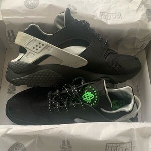 Black and Gray Nike Huaraches with Green Accents